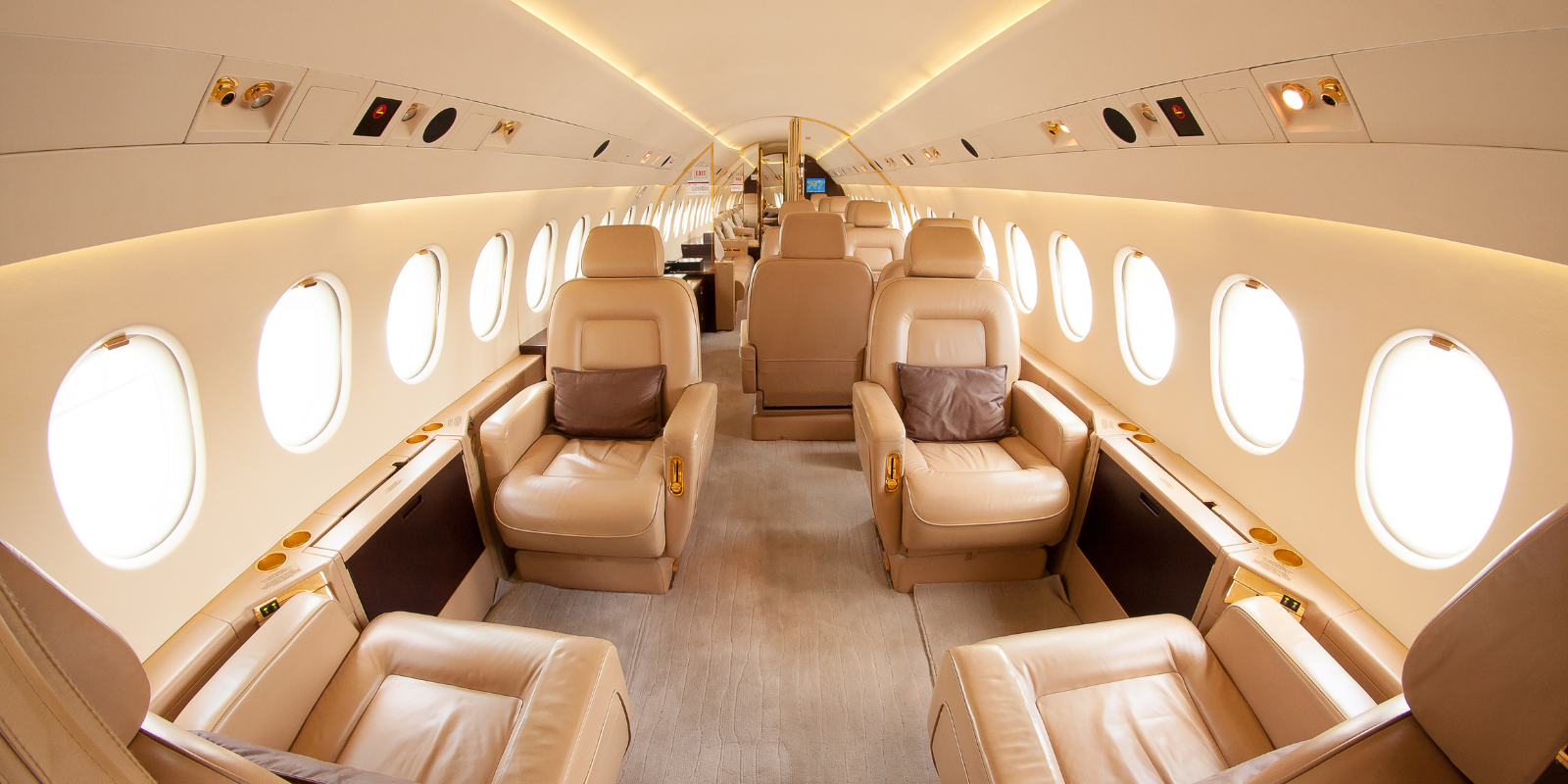 inside of a private jet with beige leather